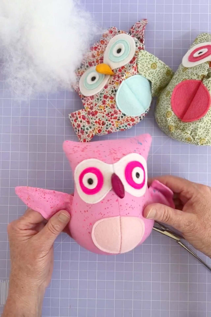 7 Stuffing Tips for Smooth, Squishy Creations: Handmade stuffed owls with colorful fabric and stuffing.