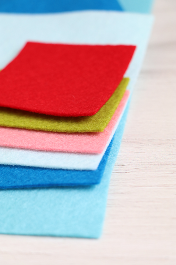 Stack of colorful felt sheets on a light surface