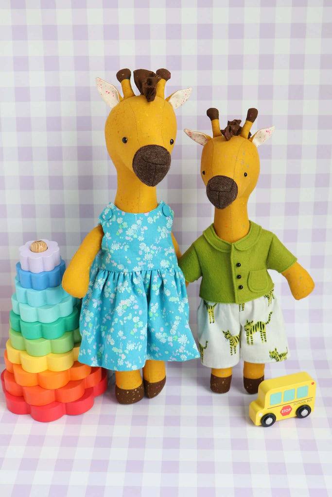 wo handmade giraffe soft toys sewn from Ricrac PDF pattern with dress and cardigan