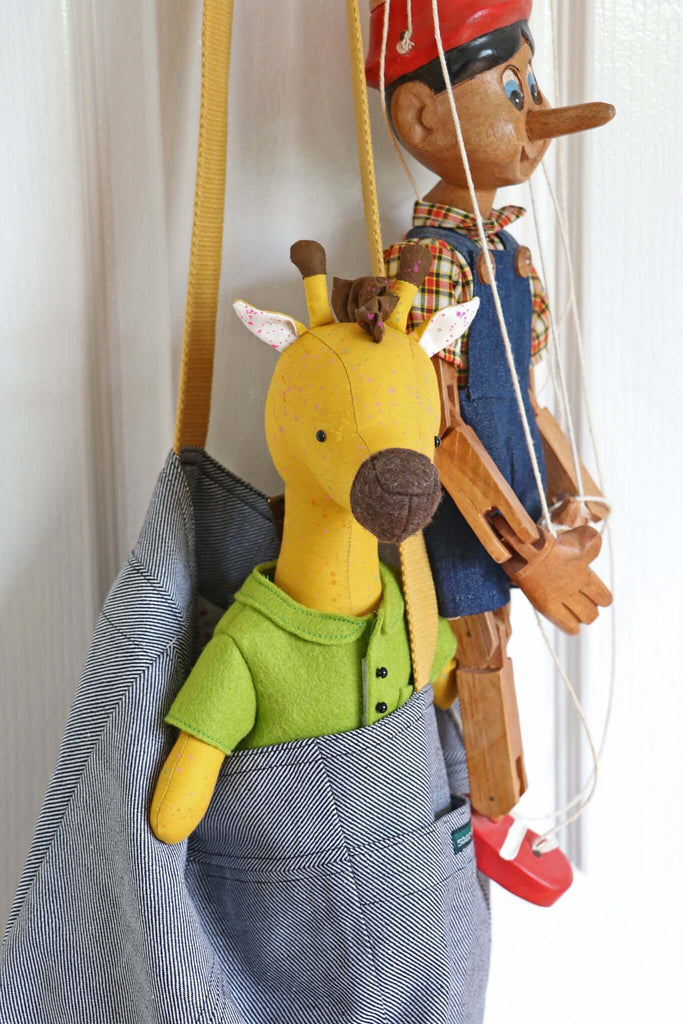 Giraffe soft toy with cardigan in bag, made using RicRac sewing pattern