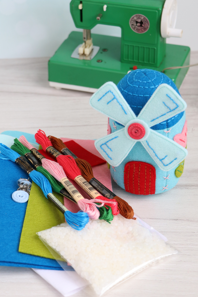 lose-up of windmill pincushion kit materials with colorful felt and embroidery floss