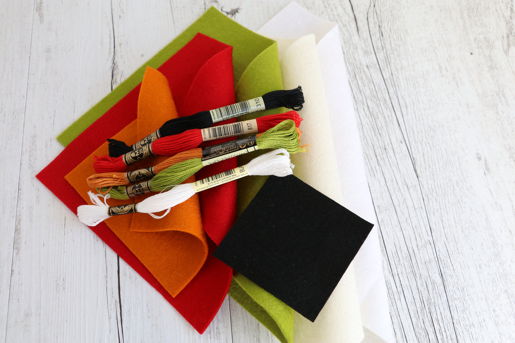 Colorful felt and embroidery threads for the Daryl & Russ sewing kit, perfect for crafting adorable felt dogs.