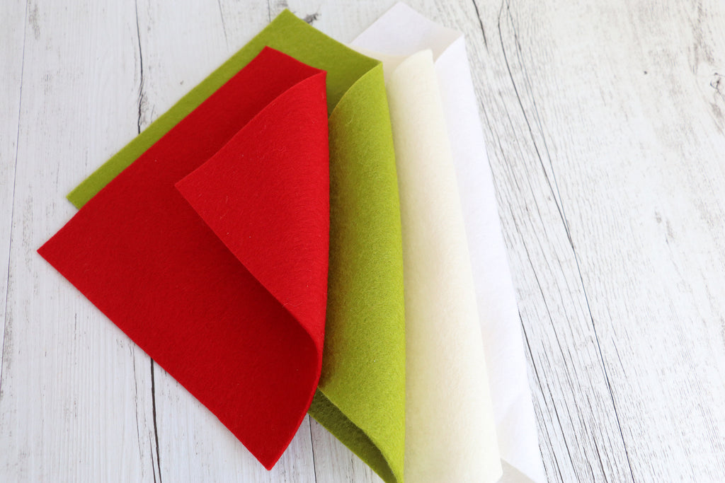 Daryl & Russ sewing kit featuring premium red, green, and white wool felt for crafting delightfully well-dressed dogs.