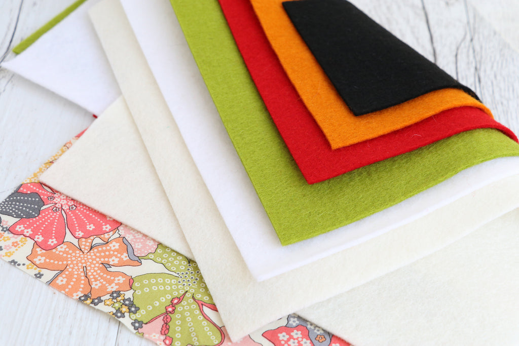 Daryl & Russ sewing kit featuring colorful premium wool felt pieces ready for crafting delightful dog figures.