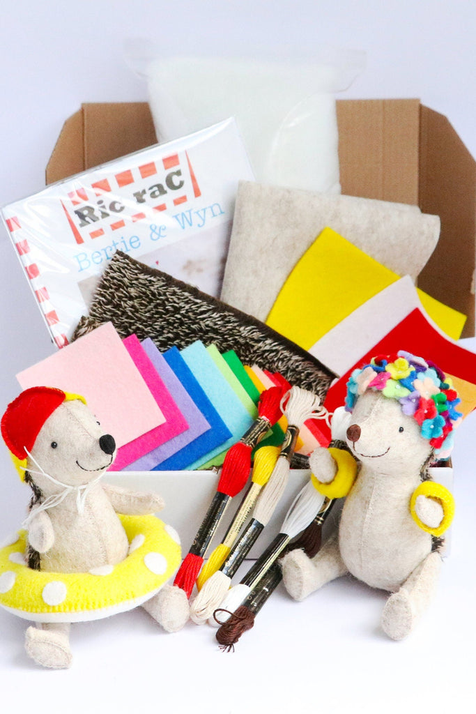 a box containing sewing supplies to make two small hedgehogs